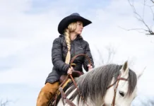 Rooted in Connection A rider works a horse over a log at Cross Brand Cowboy Church.