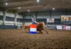 Fall Competition Comes to Connors State College A barrel racer rounds a barrel in the Fred Williams Arena at Connors State College.
