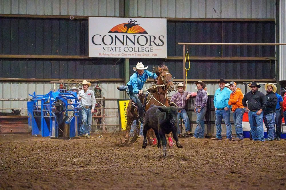 A calf roper competes at Connors State College.